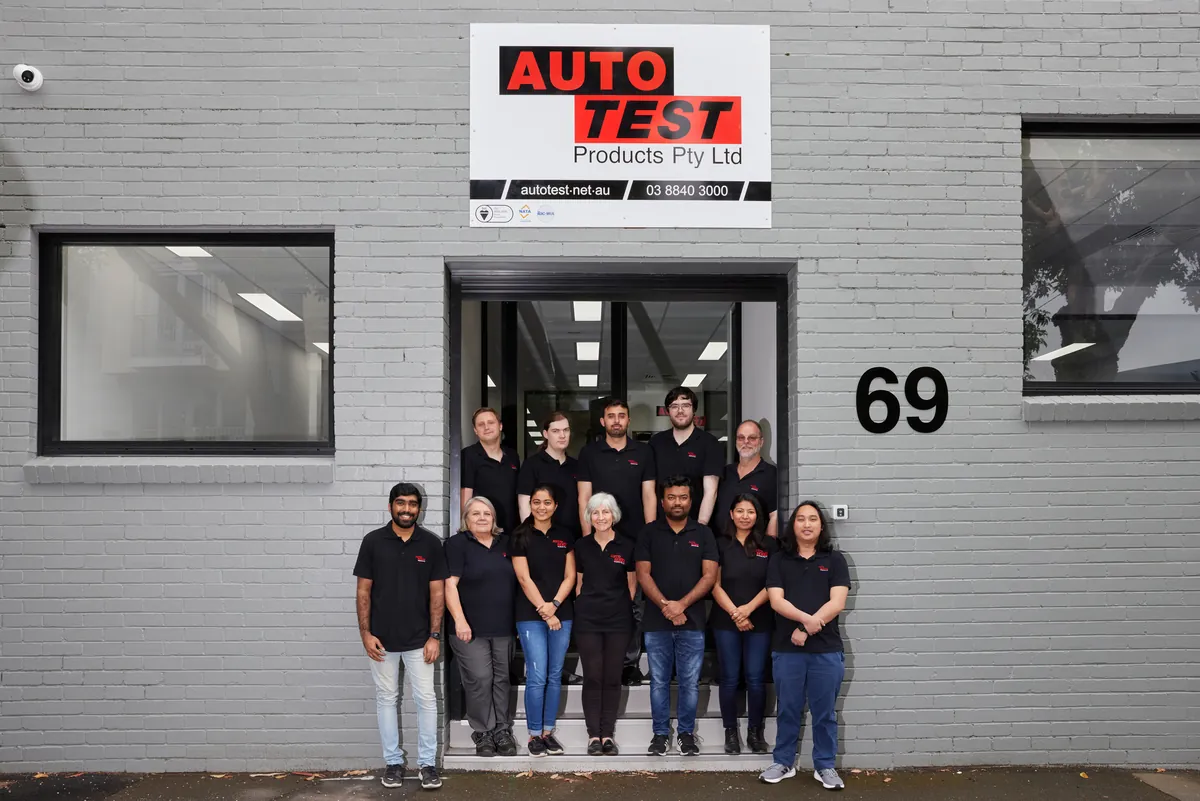 Autotest team outside the building entrance, Autotest warehouse-to-office conversion, Kensington.
