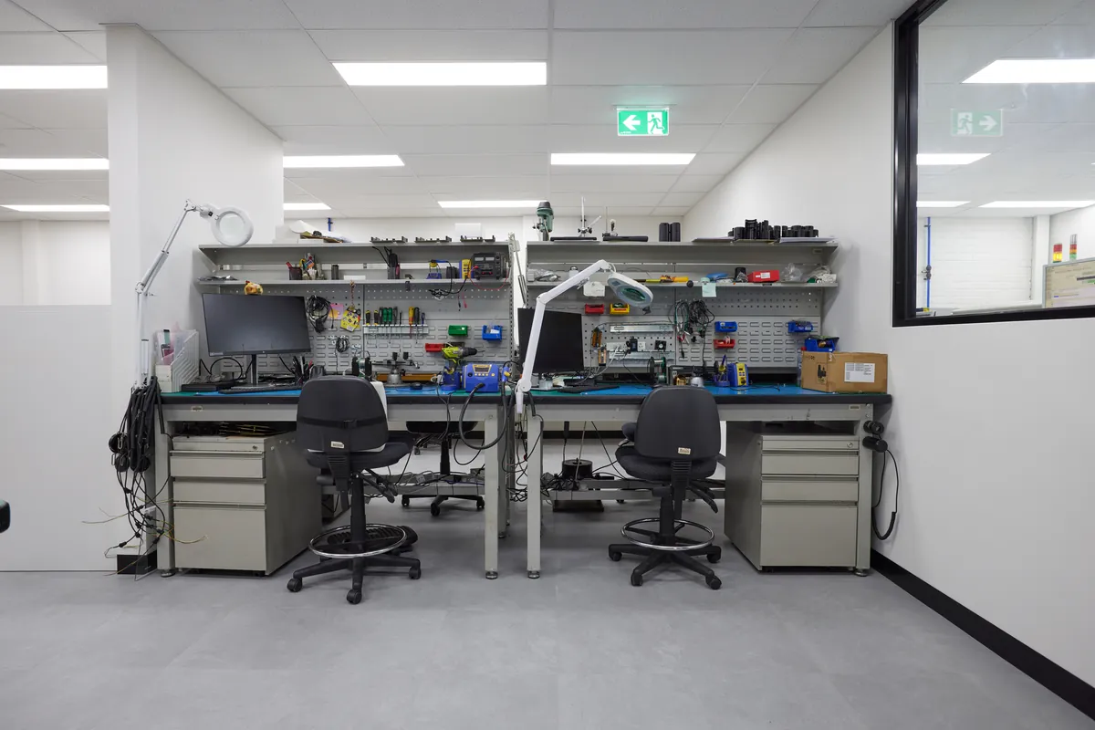 Electronics workbenches with tools and tool boards, Autotest warehouse-to-office conversion, Kensington.