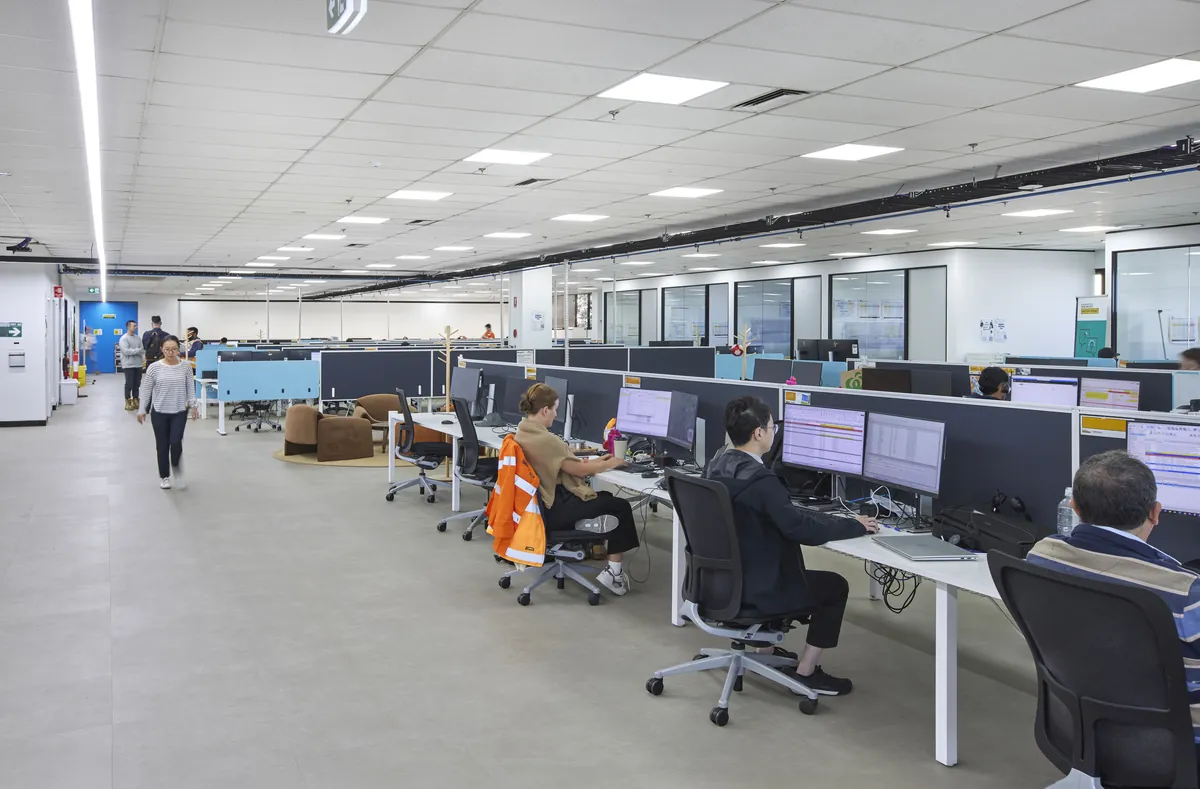 Open-plan workspace with rows of workstations and staff at the CPB Contractors office fitout, Blackburn North.