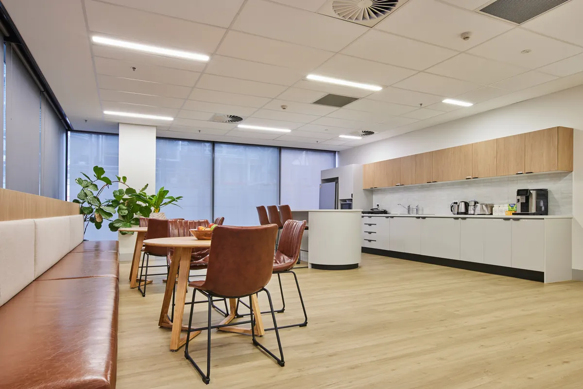 Breakout dining and kitchen zone with timber flooring at the Endress and Hauser office fitout, Mulgrave.
