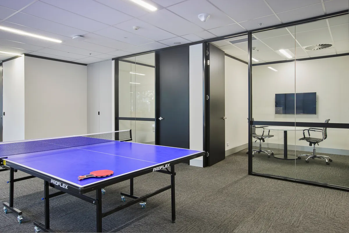 Breakout games area with table tennis and glass meeting room at the Endress and Hauser office fitout, Mulgrave.
