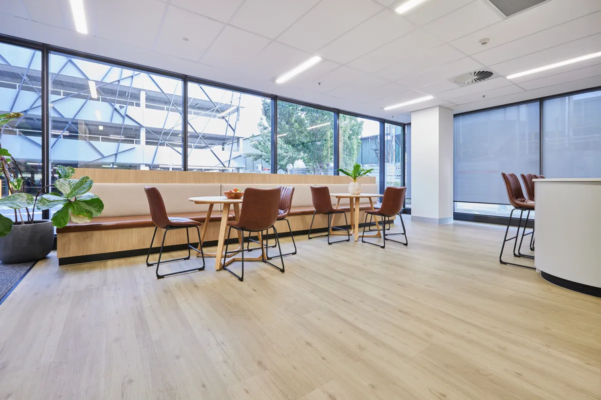 Breakout space with banquette seating and booth tables at the Endress and Hauser office fitout, Mulgrave.