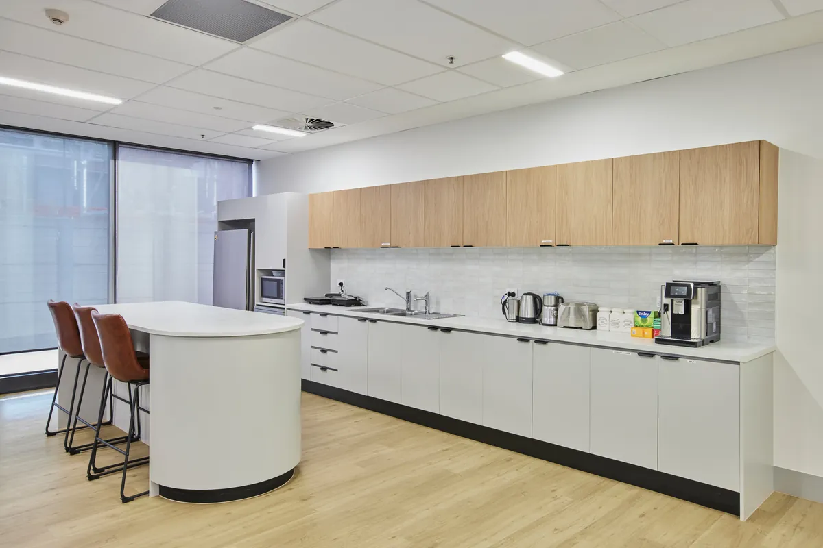 Office kitchen with island bench and timber joinery at the Endress and Hauser office fitout, Mulgrave.