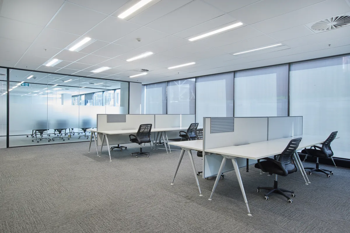 Open-plan workstations with glass meeting room beyond, Growthpoint spec suite fitout, Mulgrave.