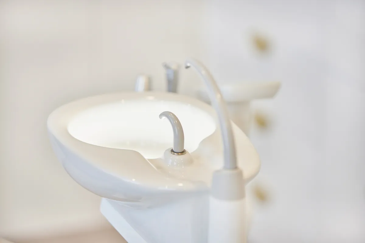 Dental spittoon basin detail in a surgery at the Kew Periodontics dental clinic fitout, Kew.