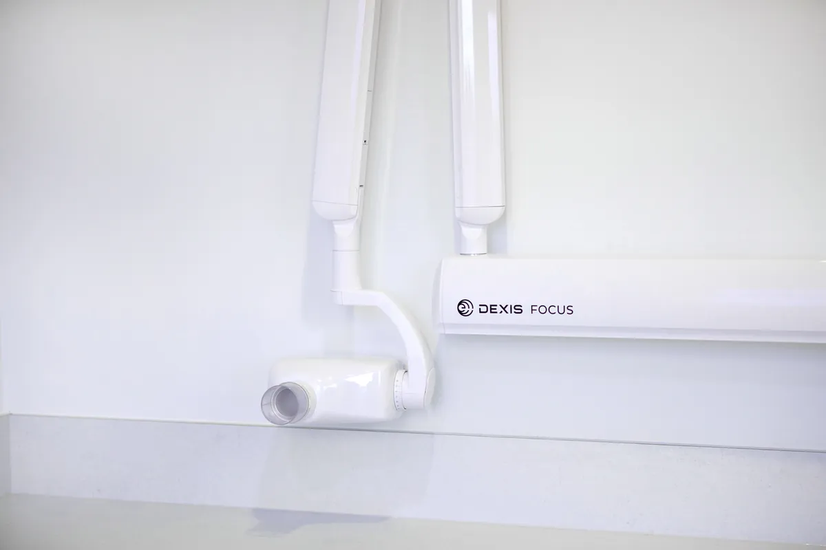 Wall-mounted Dexis Focus dental x-ray unit in an imaging area at the Kew Periodontics dental clinic fitout, Kew.