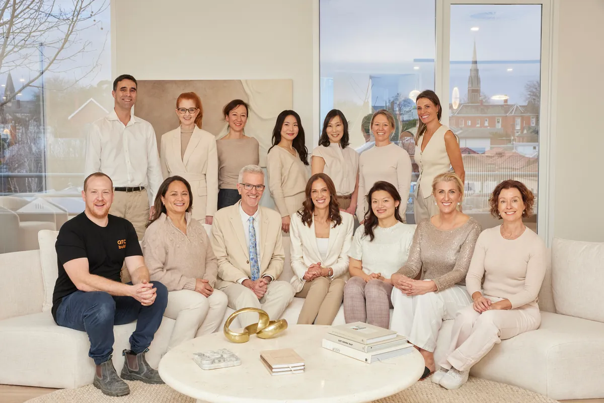 Kew Periodontics team seated in the waiting area of the dental clinic fitout, Kew.
