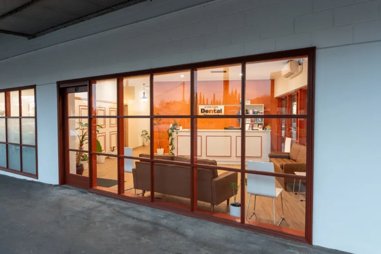 Shopfront exterior with reception visible through glazing at the Kyneton Dental dental clinic fitout, Kyneton.