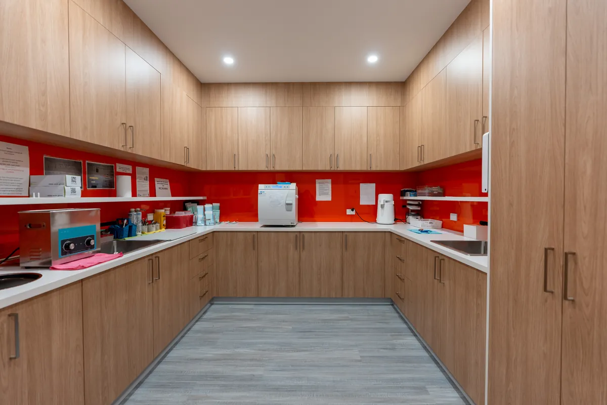 Sterilisation room with autoclave, sinks and joinery at the Kyneton Dental dental clinic fitout, Kyneton.