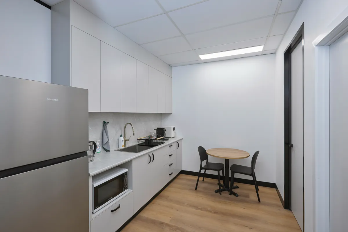 Staff kitchen and dining nook with kitchenette joinery at the Melbourne Smiles dental clinic fitout, North Caulfield.