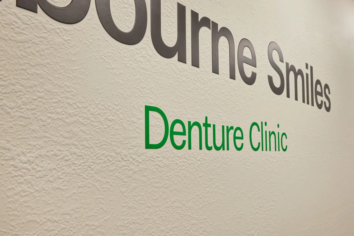 Close-up of Denture Clinic feature signage lettering at the Melbourne Smiles dental clinic fitout, North Caulfield.