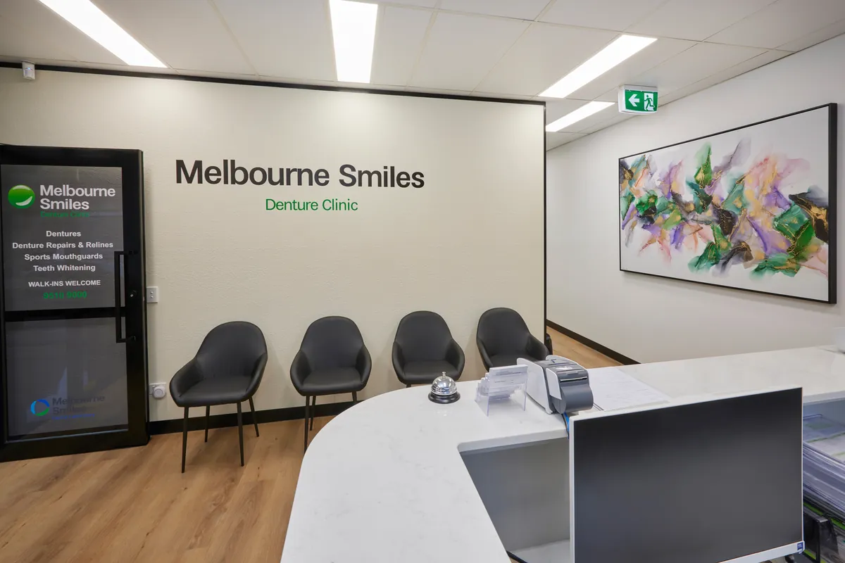 Reception desk and waiting area seating at the Melbourne Smiles dental clinic fitout, North Caulfield.