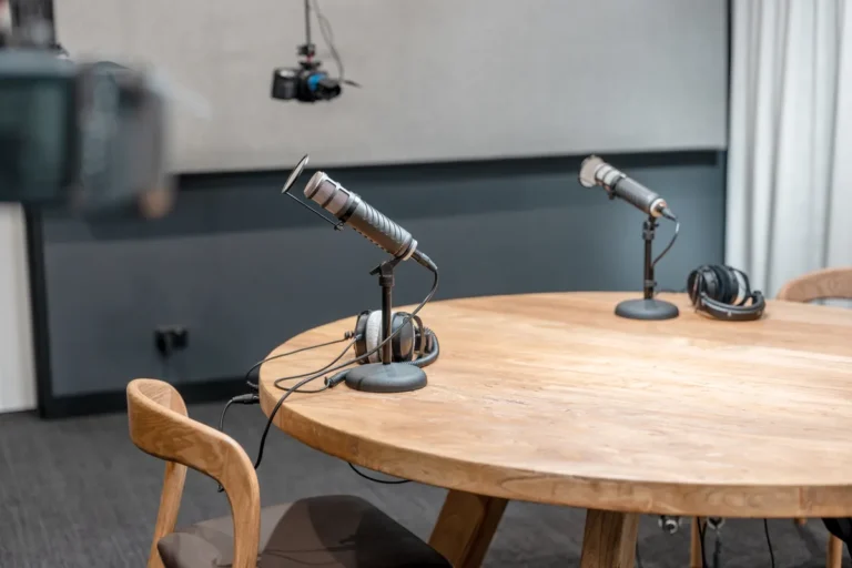 Podcast studio table with microphones and headphones at the Resilience Project office fitout, Collingwood.