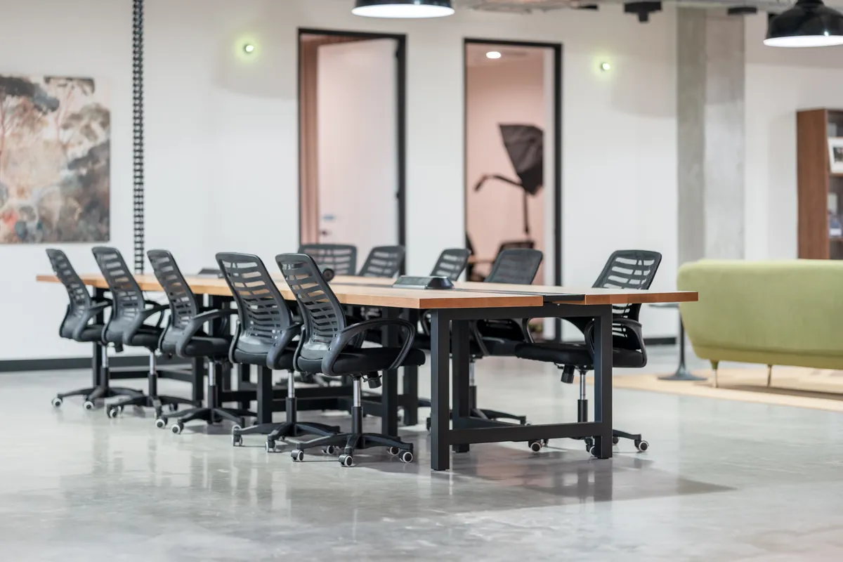 Bench-desk workstations with ergonomic chairs at the Resilience Project office fitout, Collingwood.