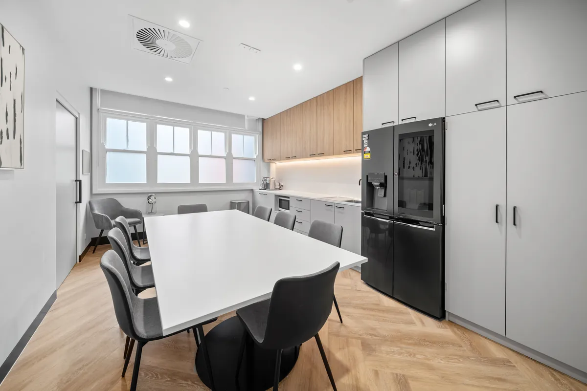 Breakout dining area with timber joinery and storage at the SleepWise Clinic dental clinic fitout, Melbourne.