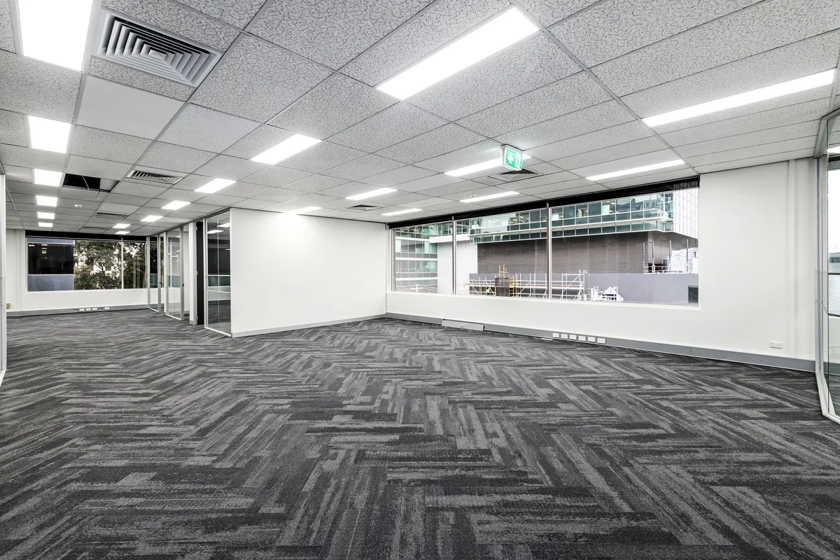 Corner open plan floor space with dual aspect windows, spec suite fitout Southbank